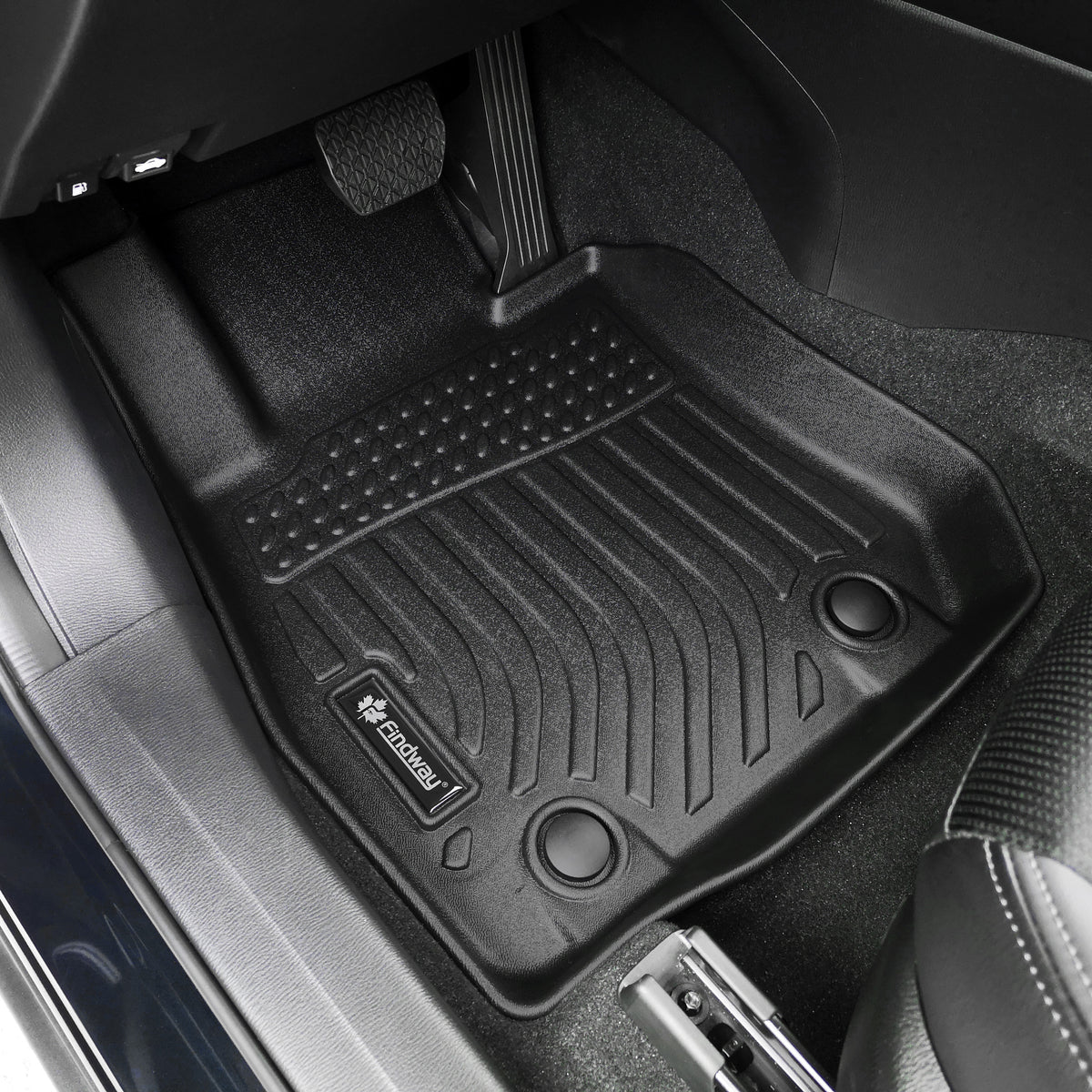 Black car floor mat with a Findway logo on a vehicle interior.